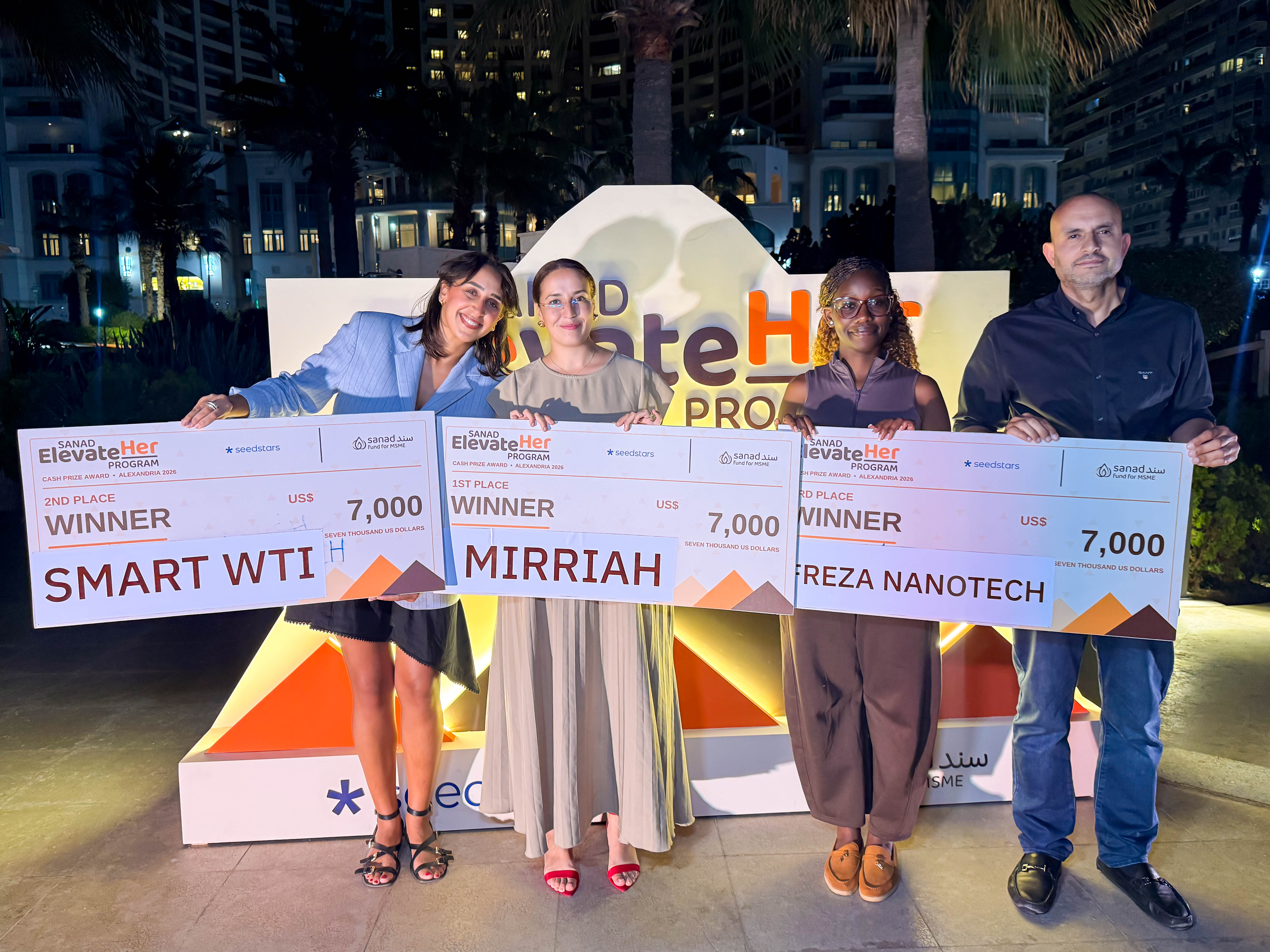 Nidal Tafah of MIRRIAH, Samantha Ainembabazi of Freza Nanotech, Mohamed Morsy of Finance in Motion and Sabrina Salama of Seedstars, representing SmartWTI, at the SANAD ElevateHer cash-prize presentation in Alexandria on 4 October 2026.