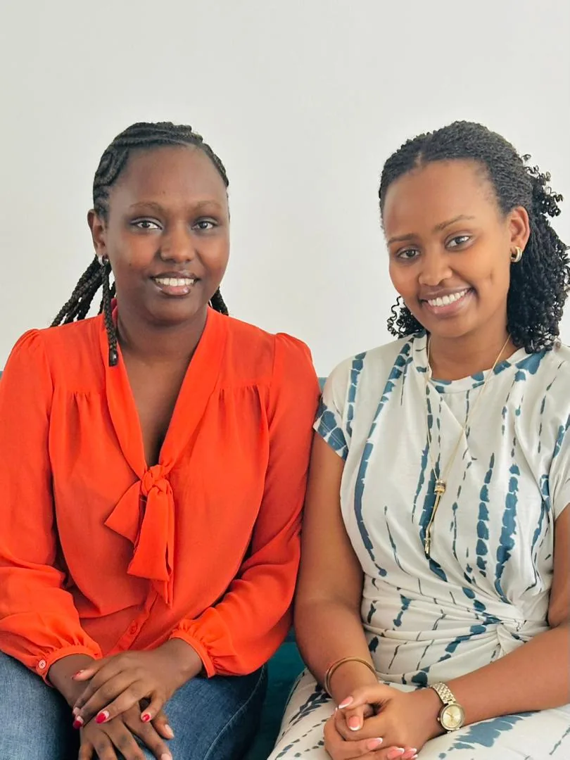 Two EcoGreen Solutions team members seated together