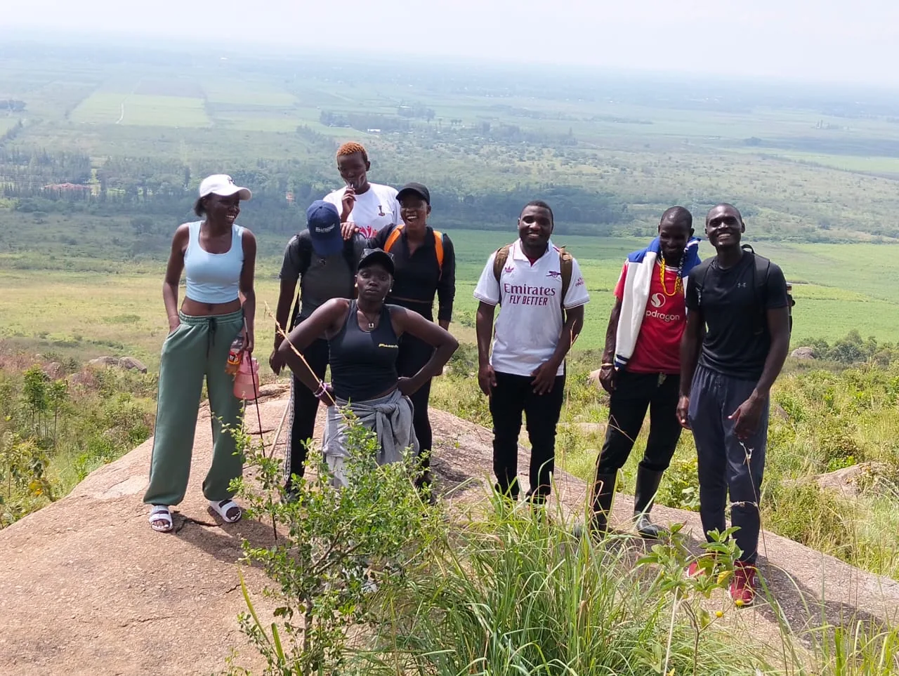 Brisfa team photographed outdoors on a hillside